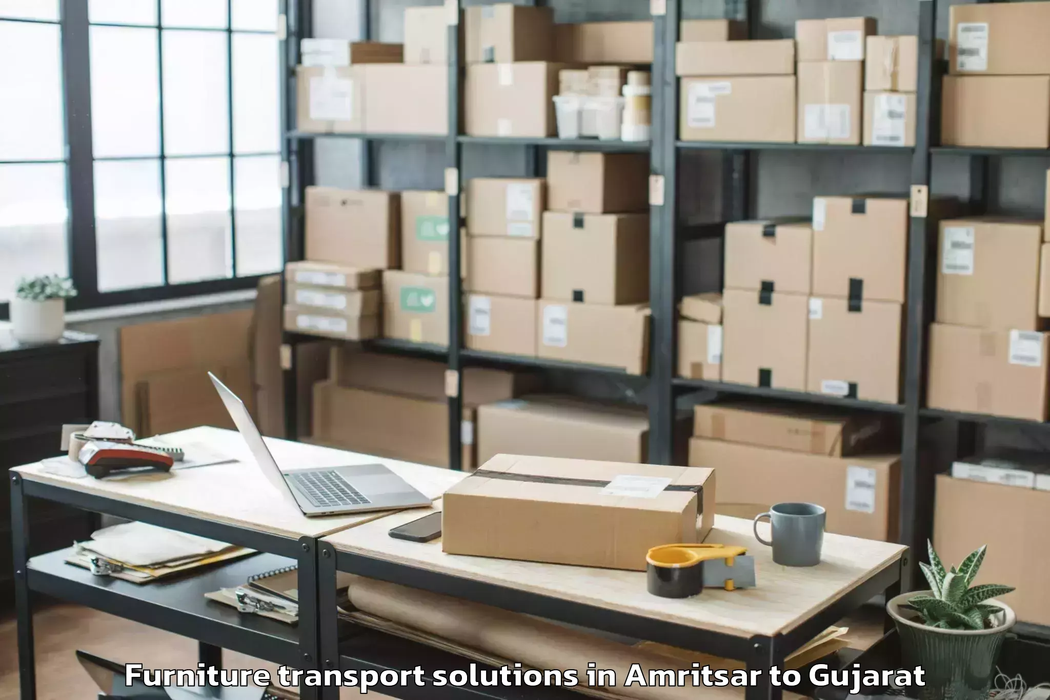 Book Amritsar to Wankaner Furniture Transport Solutions